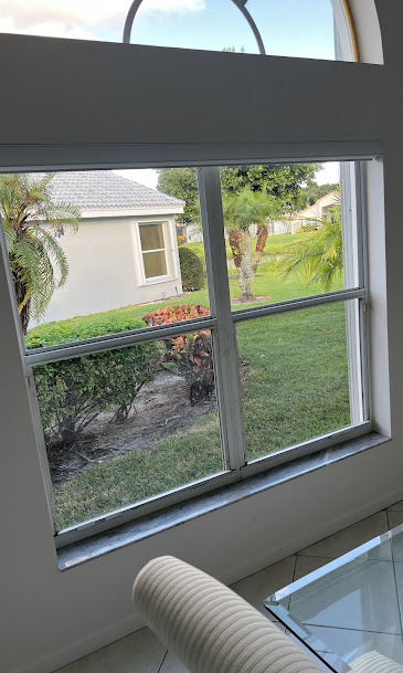 Window being repaired by technician